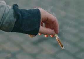 Person holding a cigarette